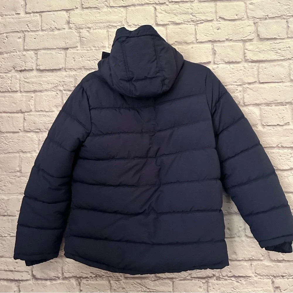 Boden boys' winter puffer jacket in navy blue.